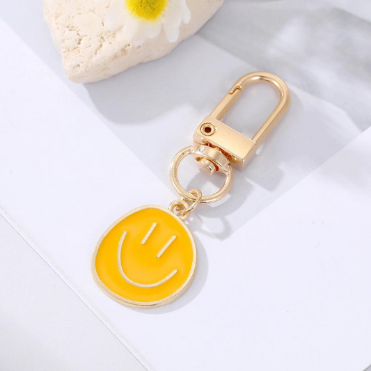 mini happy face keychain in yellow