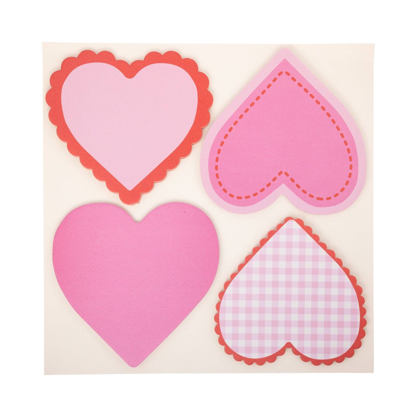 Pink and red heart-shaped paper notes included in the Heart Attack Love Notes Kit