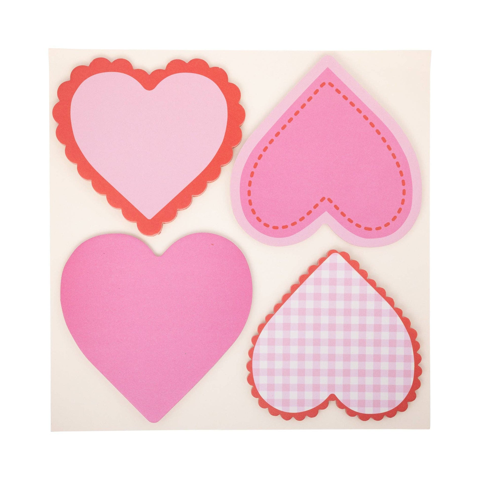 Pink and red heart-shaped paper notes included in the Heart Attack Love Notes Kit