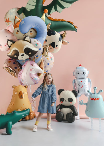 Kids holding balloon bundle with animal and alien foil balloons in a colourful party scene, available at our Toronto party shop.