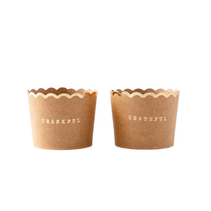 Kraft baking cups with scalloped edge and gold foil lettering “Thankful” and “Grateful,” available at our Toronto party shop.