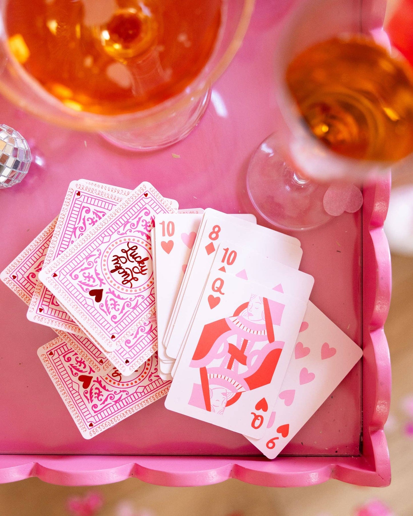 Lucky Valentine’s playing cards styled for a Galentine’s party with drinks and pink decor in Toronto