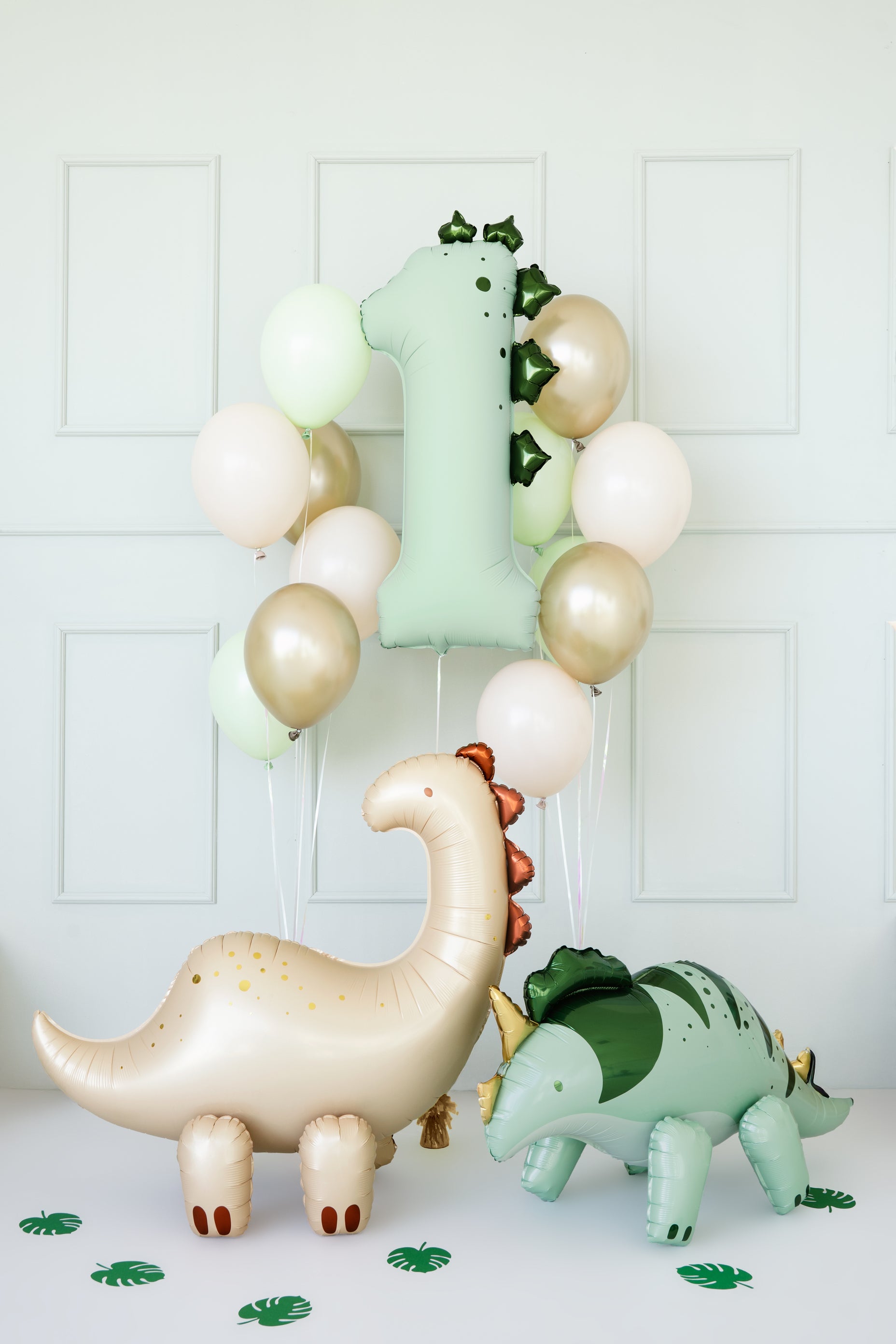 Dinosaur number 1 balloon styled with matching balloons at a first birthday setup, available in Toronto at Confetti My Party. Ships across Canada.