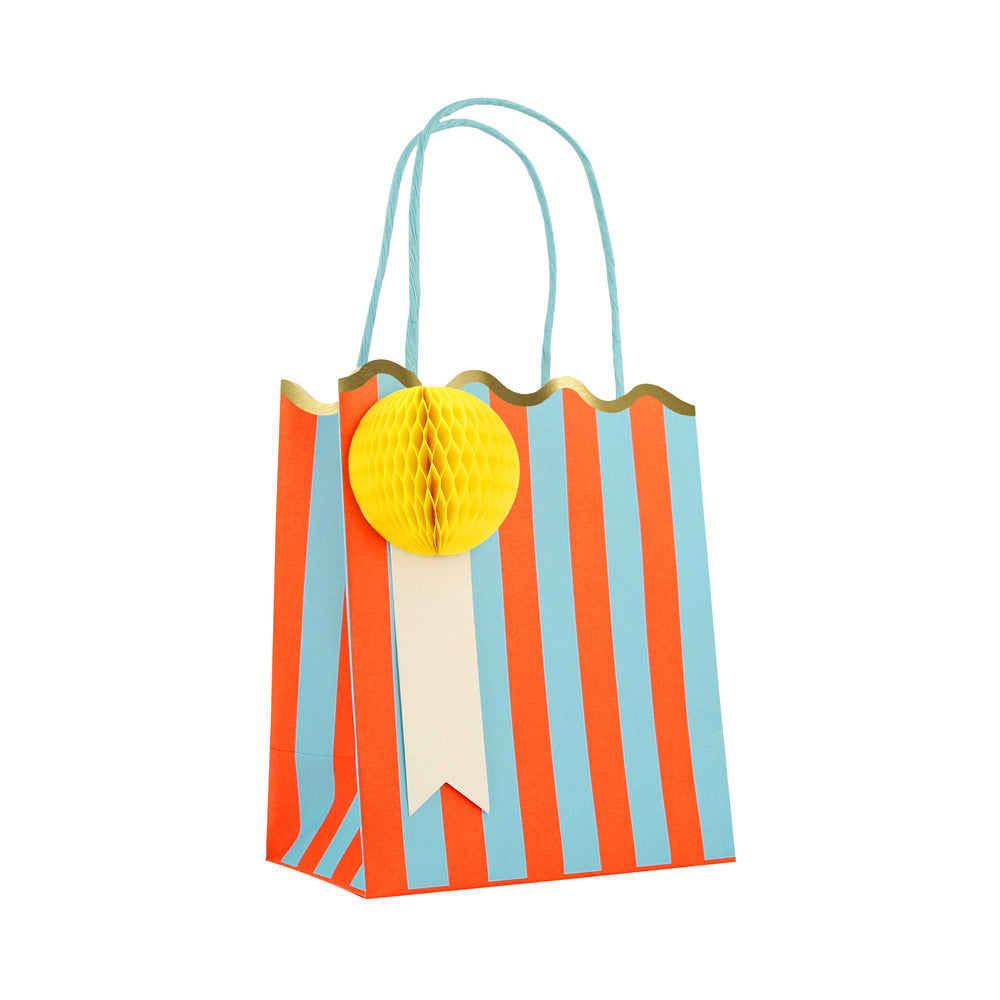 Meri Meri blue and orange striped party bag with yellow honeycomb gift tag