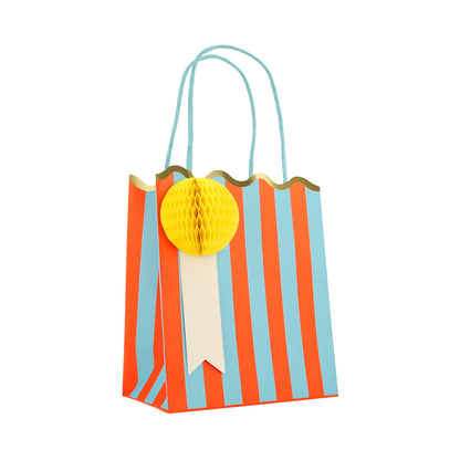 Meri Meri blue and orange striped party bag with yellow honeycomb gift tag