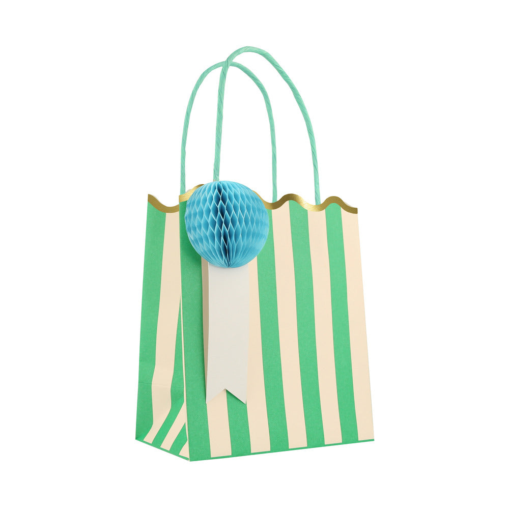 Meri Meri green striped party bag with blue honeycomb gift tag