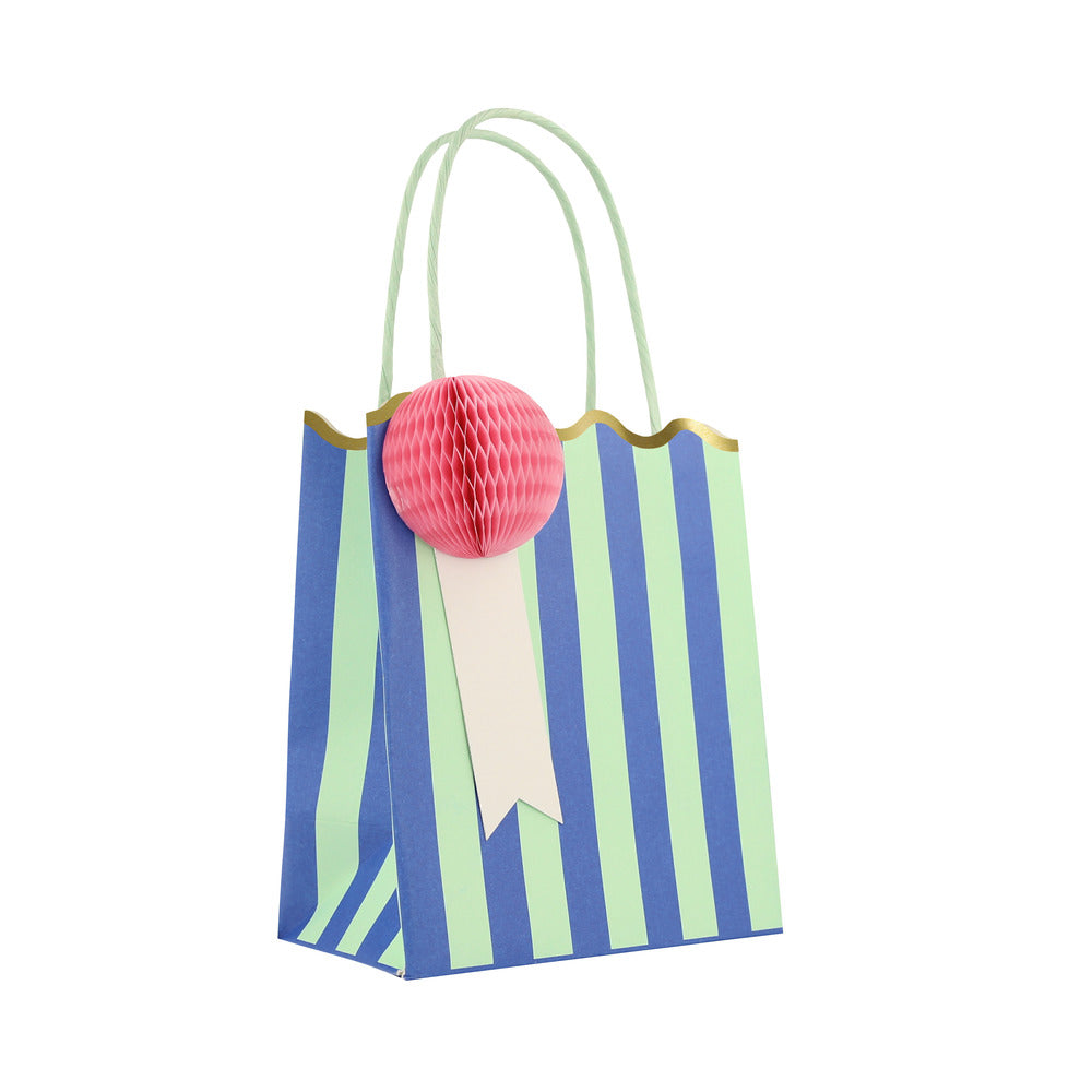 Meri Meri green striped party bag with purple honeycomb gift tag