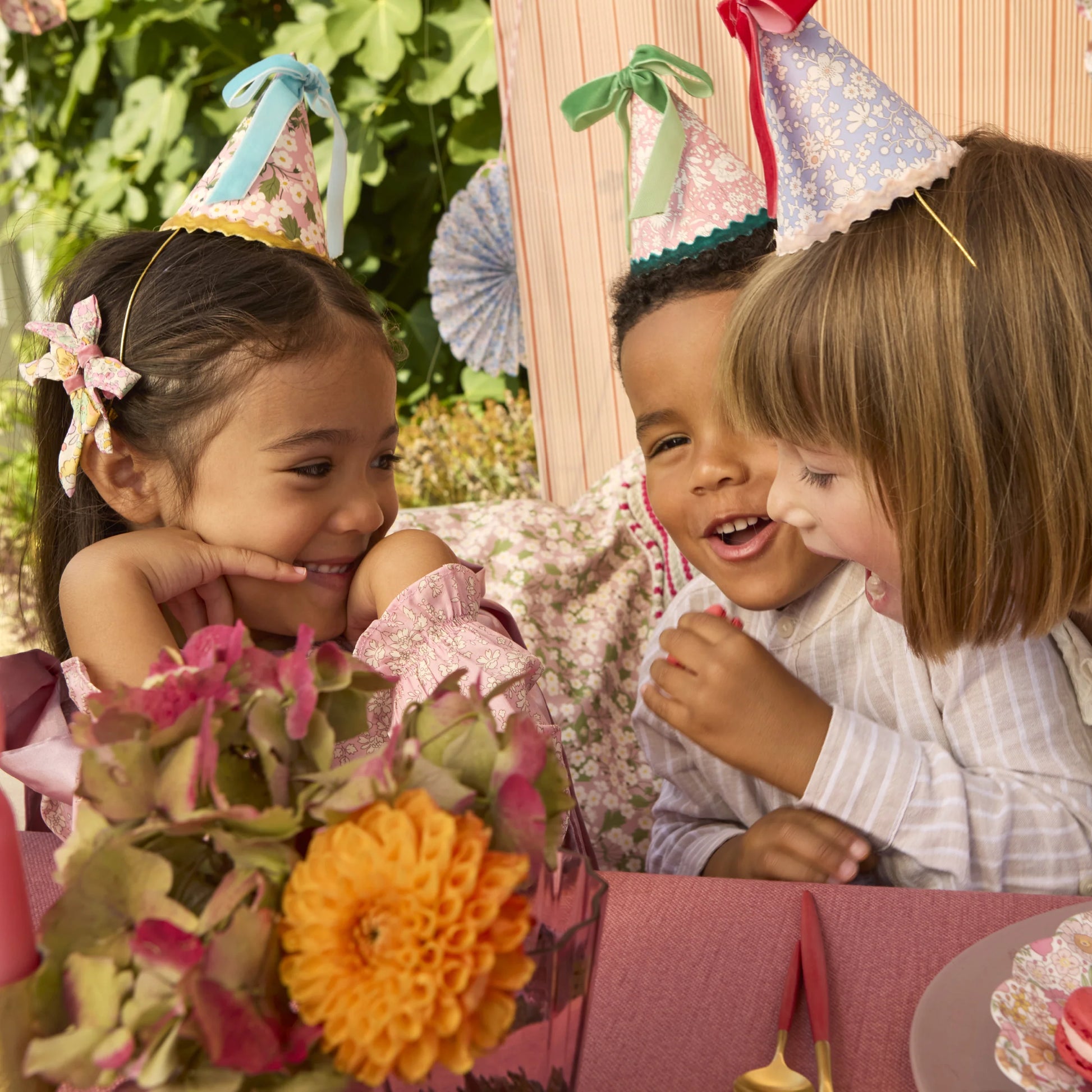 Liberty floral party hats by Meri Meri with velvet bows and scalloped trim, available in Toronto and shipping across Canada