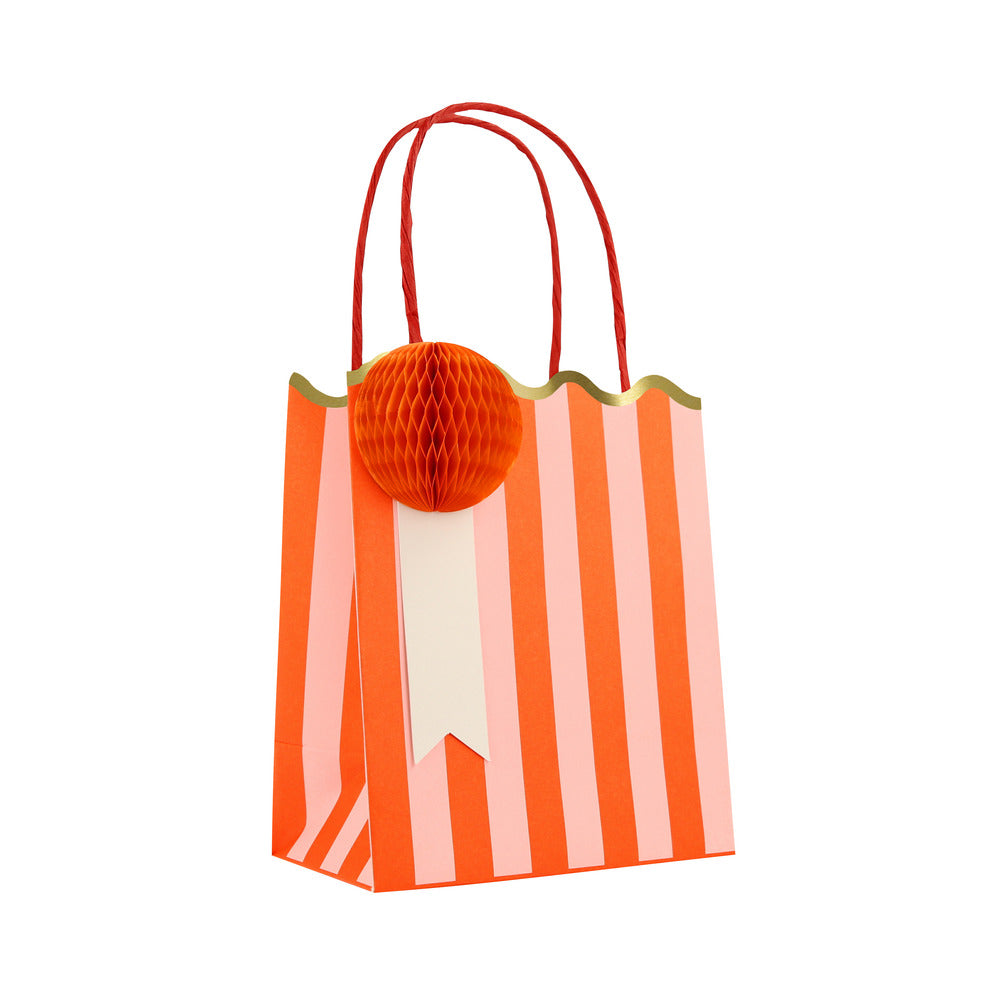 Meri Meri orange striped party bag with red honeycomb gift tag