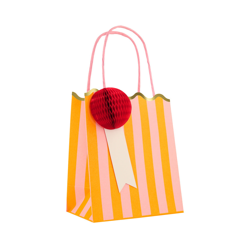 Meri Meri peach striped party bag with red honeycomb gift tag