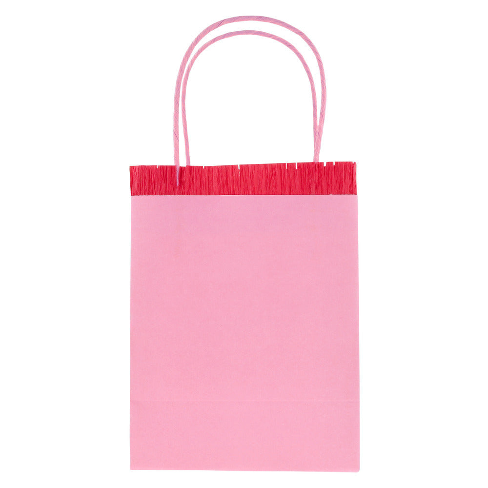 Meri Meri pink paper party bag with red fringe