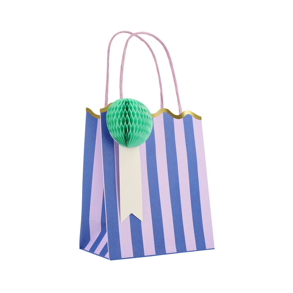 Meri Meri purple and blue striped party bag with green honeycomb gift tag