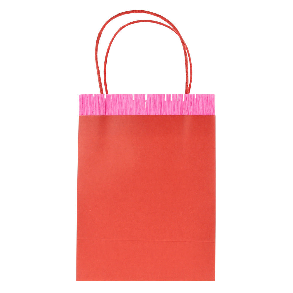 Meri Meri red paper party bag with bright pink fringe