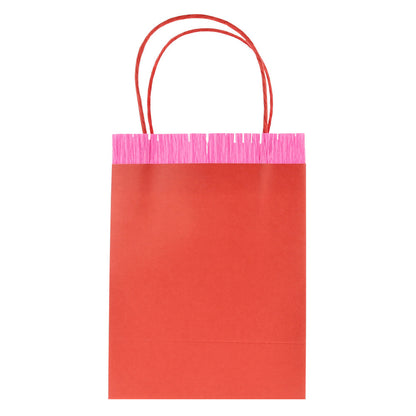 Meri Meri red paper party bag with bright pink fringe