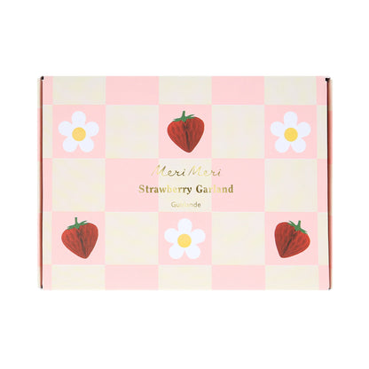 Packaging of Meri Meri strawberry garland with strawberry and daisy illustrations.
