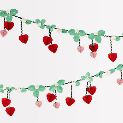 Detail of Meri Meri strawberry garland showing red and pink honeycomb berries