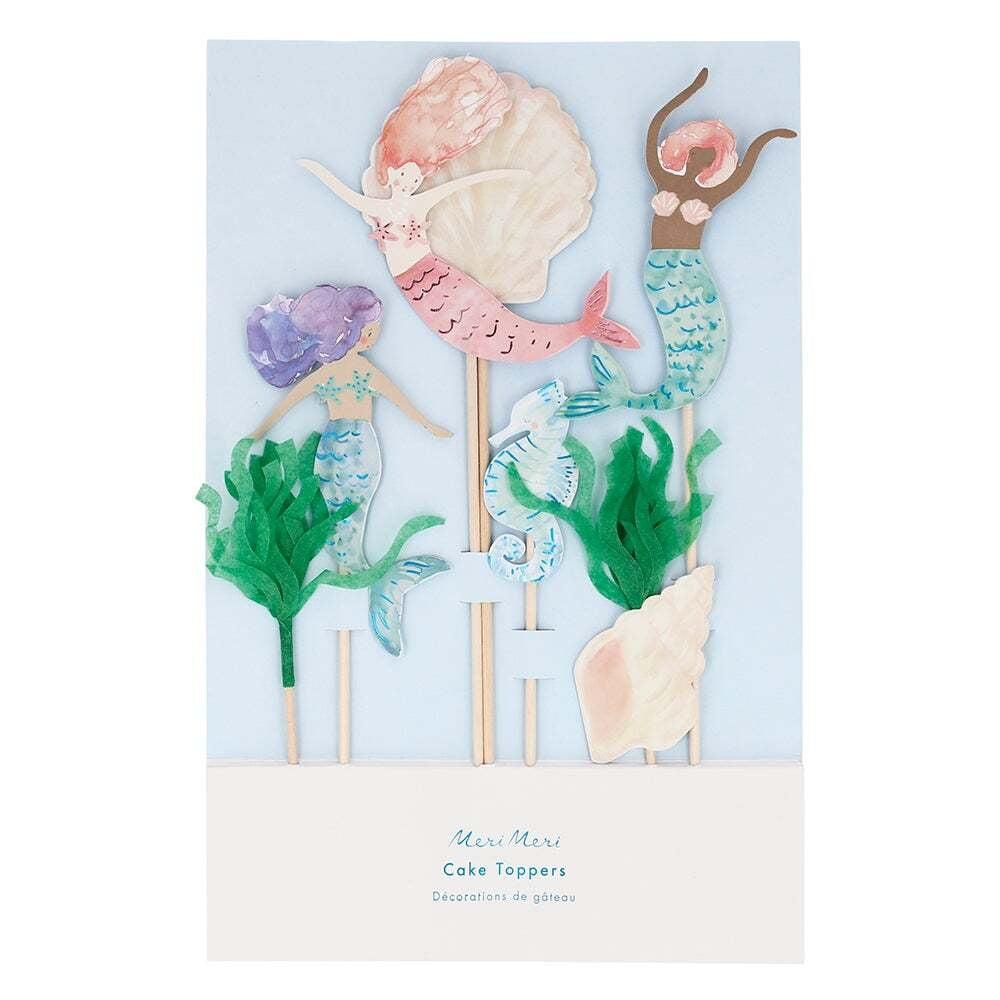 Set of mermaid-themed cake toppers on sticks with a light blue background
