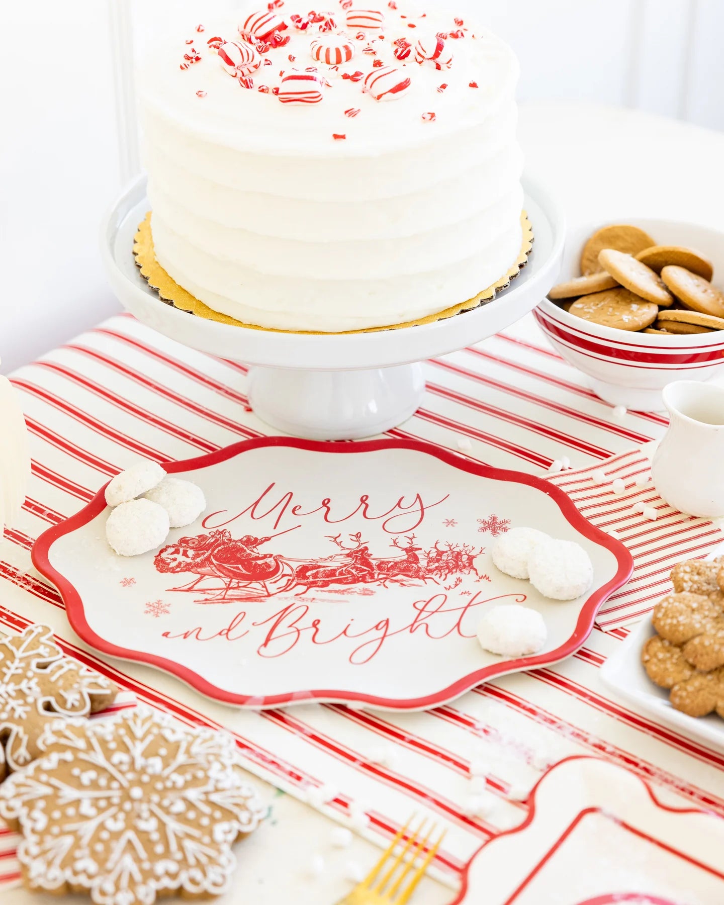 Merry and Bright bamboo tray styled with peppermint cake and cookies on red striped holiday table. Sold at Confetti My Party and fast shipping Canada-wide.