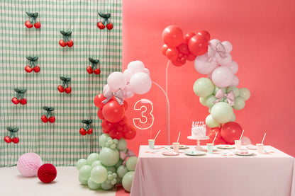 Mini cherry foil balloons styled in a balloon garland with red, pink, and sage green balloons, perfect for Toronto parties.