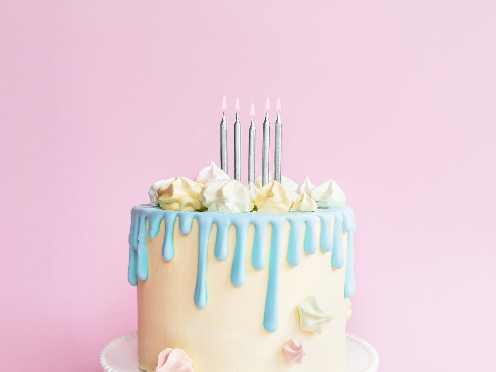 Mini silver metallic candles on pastel drip cake, styled and sold at Confetti My Party Toronto