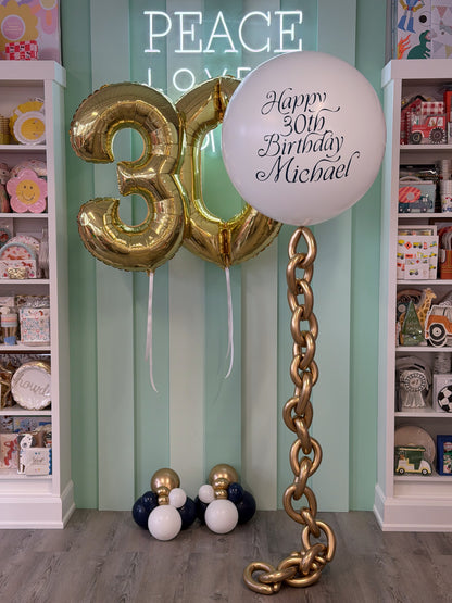 Navy, white and gold nautical birthday balloon bundle with personalized jumbo balloon, white gold number balloons and statement balloon chain in Toronto.