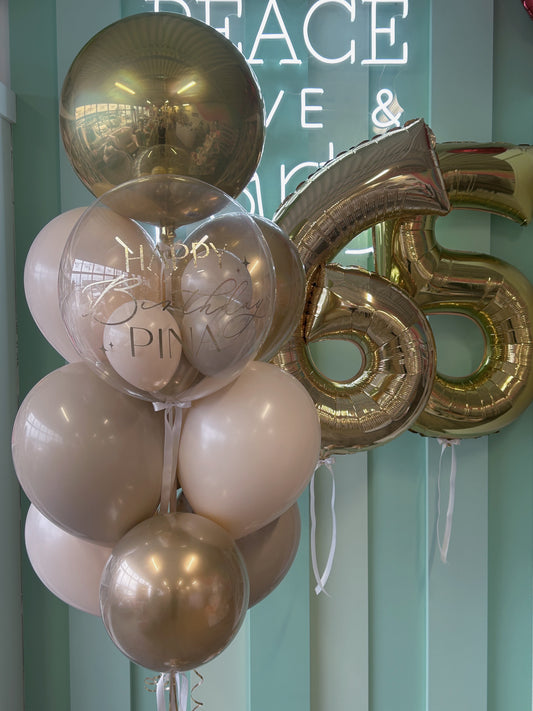 Neutral luxe birthday balloon column paired with gold jumbo number balloons, available in Toronto from Confetti My Party