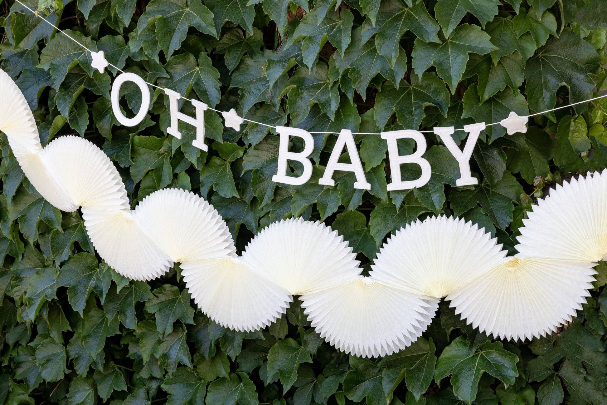 Cream tissue bunting banner styled with “Oh Baby” garland, sold in Toronto with fast Canada-wide shipping.
