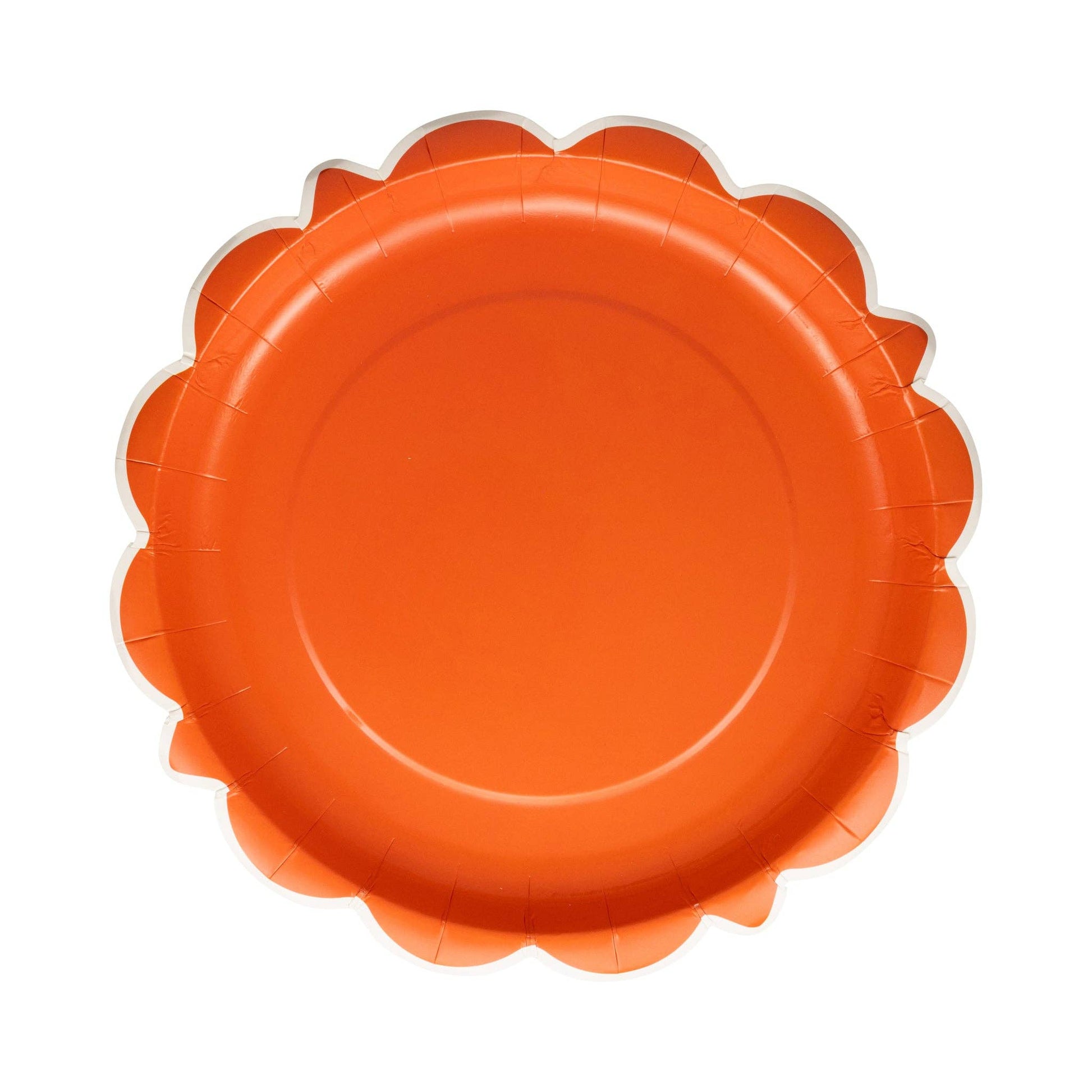 Scalloped paper plate with bold orange finish, available at our Toronto party shop for fall and Thanksgiving tables.