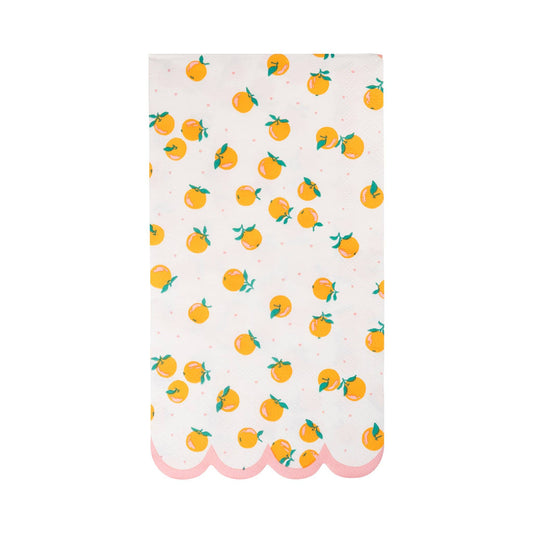 White dinner napkin with orange fruit print and pink scalloped border, perfect for Toronto summer parties.