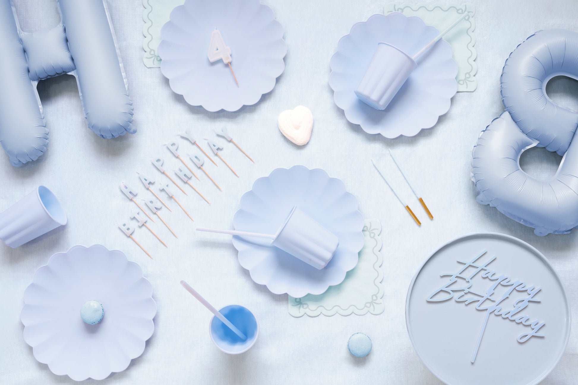 Light blue birthday candles styled with pastel blue party supplies available at our Toronto party shop