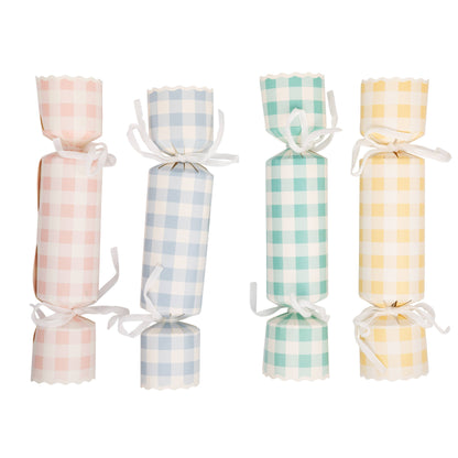 Pastel gingham Easter party crackers in pink, blue, mint green and yellow with white ribbon ties. Set of 12. Pick up in Toronto + Canada-wide shipping available.