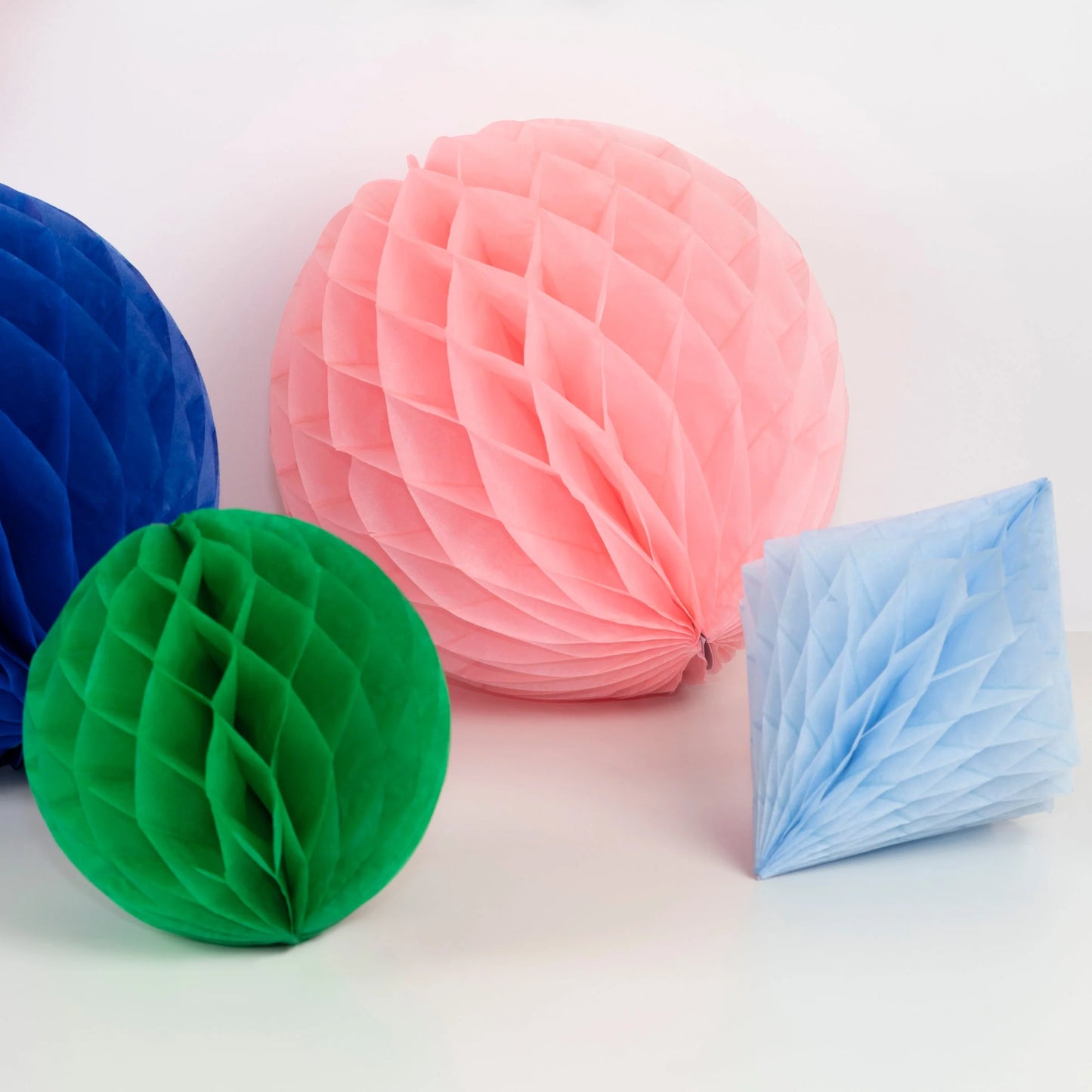  Pink and green honeycomb decorations with folded light blue honeycomb diamond