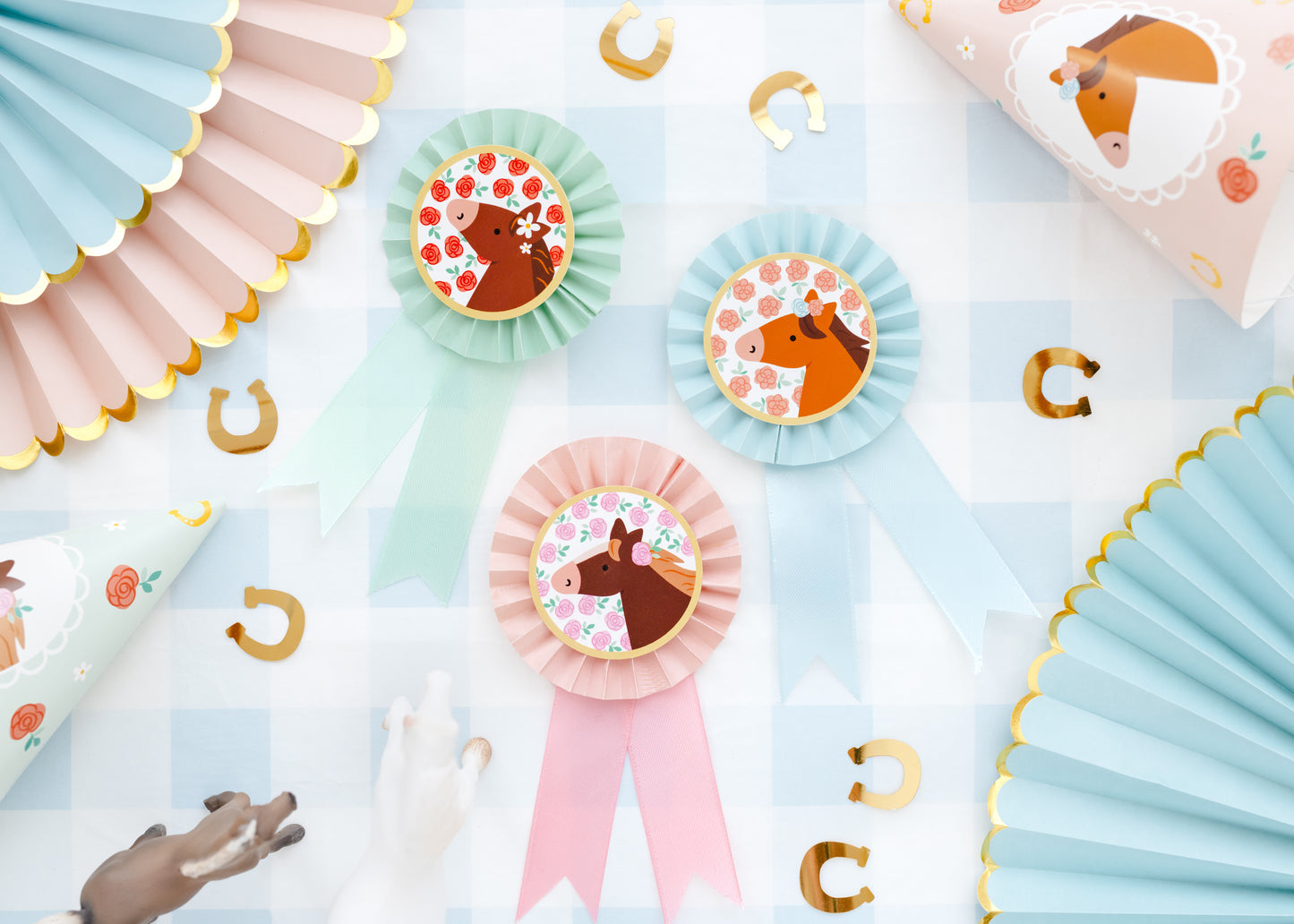 Pony-themed rosette badges styled on pastel party table, available at Confetti My Party Toronto