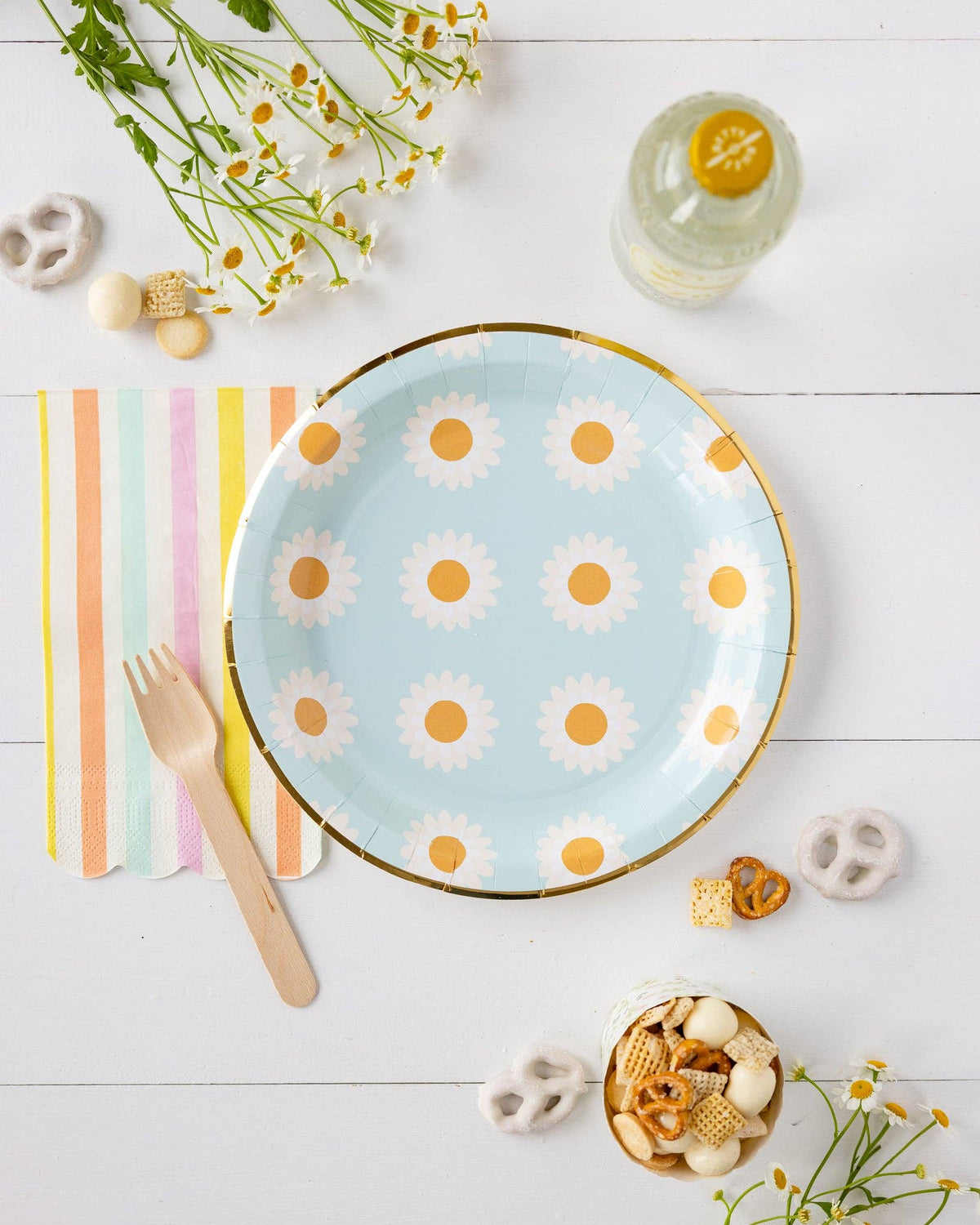 Pastel stripe dinner napkin paired with a blue daisy paper plate, wooden fork and spring party decorations. Pick up in Toronto + Canada-wide shipping available.