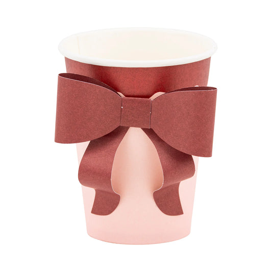 Pink paper cup with 3D burgundy bow detail, elegant holiday drinkware from Toronto party shop Confetti My Party.