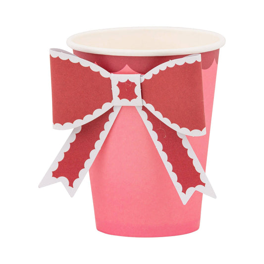 Pink paper party cup with a decorative bow design, sold in Toronto at Confetti My Party 🎀