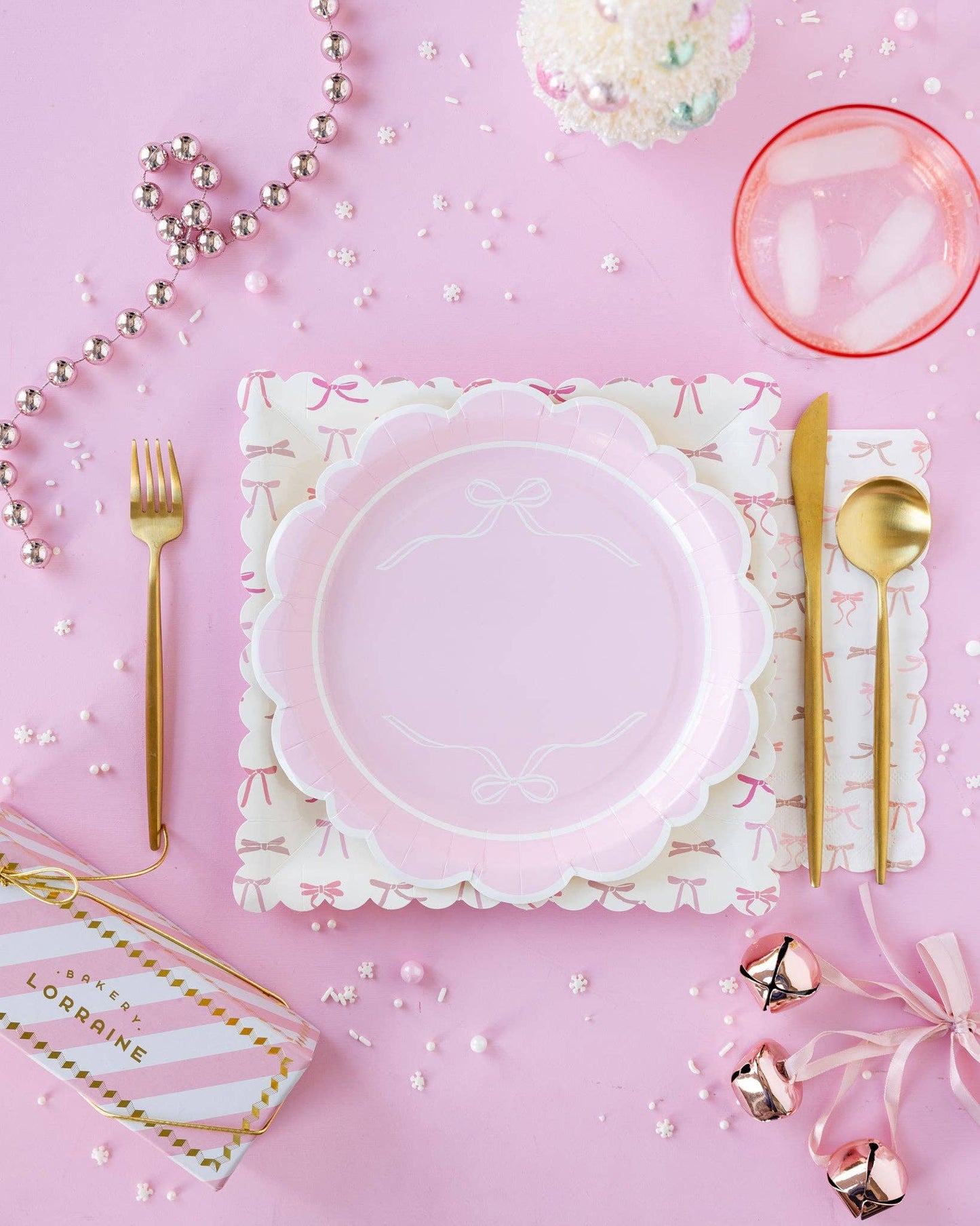Pink bow scalloped plates styled in a soft pink tablescape, available in Toronto at Confetti My Party