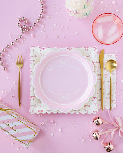 Pink bow scalloped plates styled in a soft pink tablescape, available in Toronto at Confetti My Party