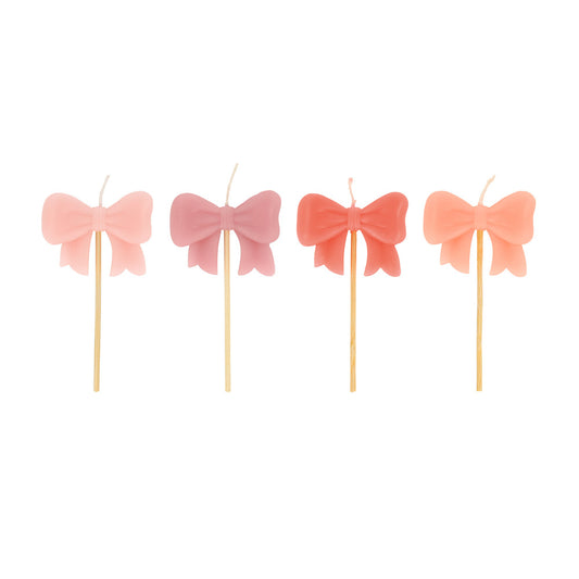 pink bow shaped candles - pack of 4 approx. 4 inches
