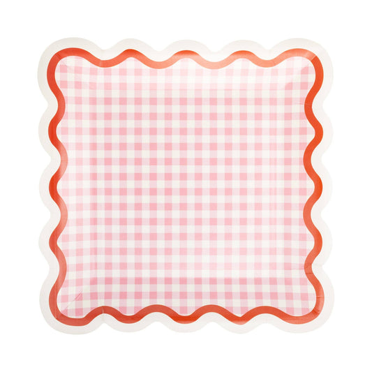 Pink gingham square paper plates with red and cream wavy scalloped edge