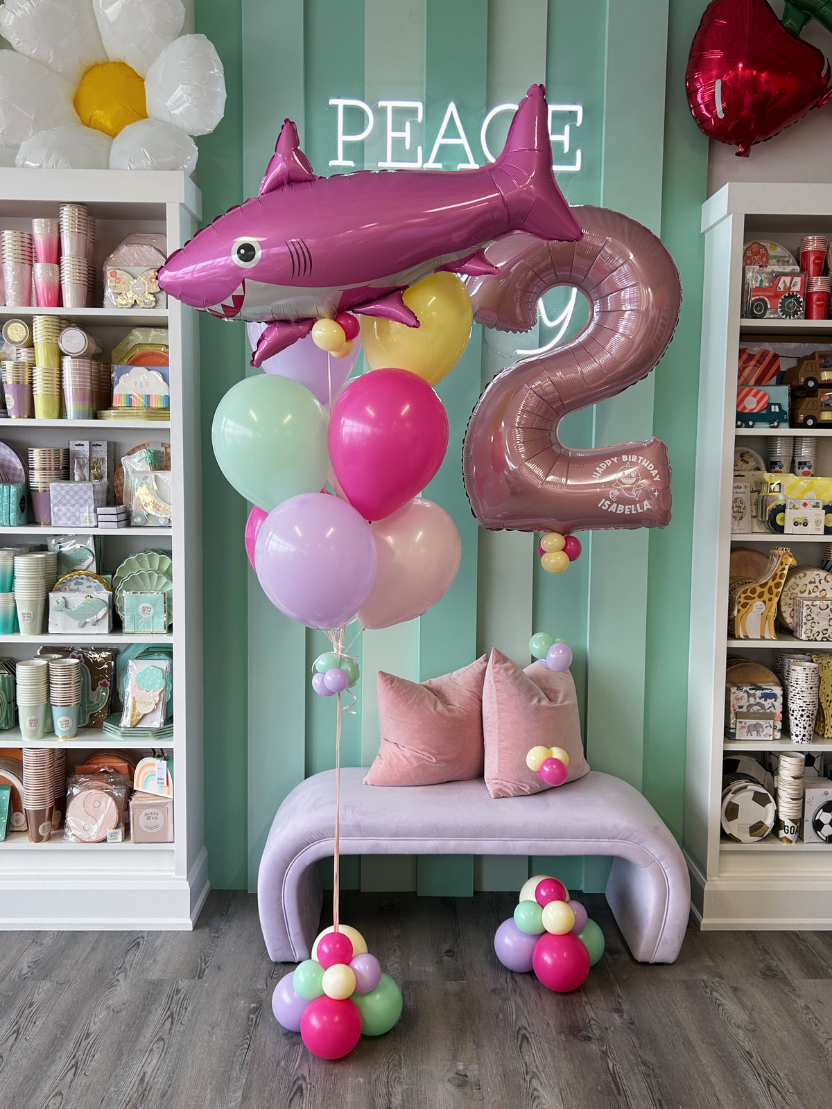 Pink shark birthday balloon bundle featuring an oversized shark foil balloon, pink number 2, pastel helium balloons and personalized birthday message in Toronto.