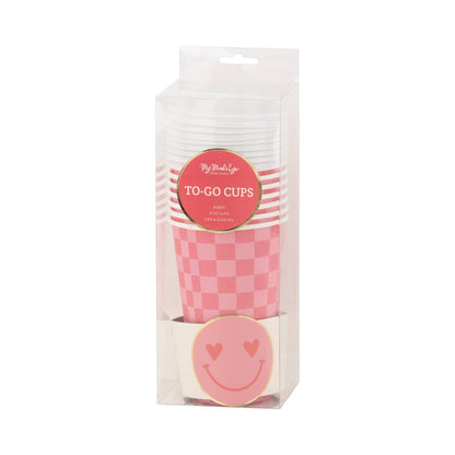 Pack of pink checkered to-go cups with a smiley face design on a white background