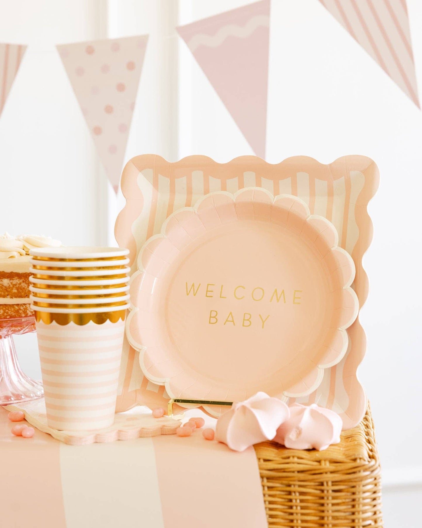 Pink striped scalloped square paper plates with soft blush details available at our Toronto party shop.