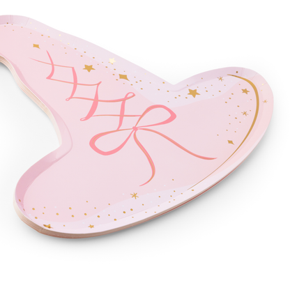 Close-up of pink witch hat paper plates with bow, stars and gold foil details