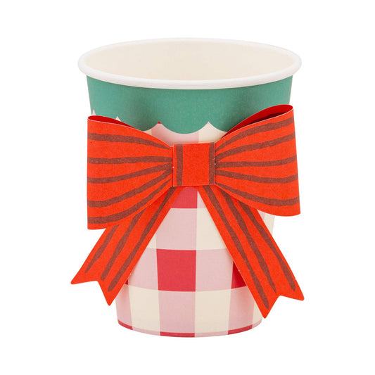 Red plaid paper cup with scalloped green rim and festive red bow, perfect for Christmas parties in Toronto.