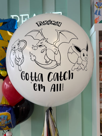 Close-up of jumbo Pokémon birthday balloon with “Gotta Catch ’Em All” design for a Toronto kids birthday celebration.