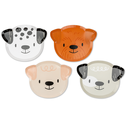 Four dog-shaped plates with different color schemes on a white background