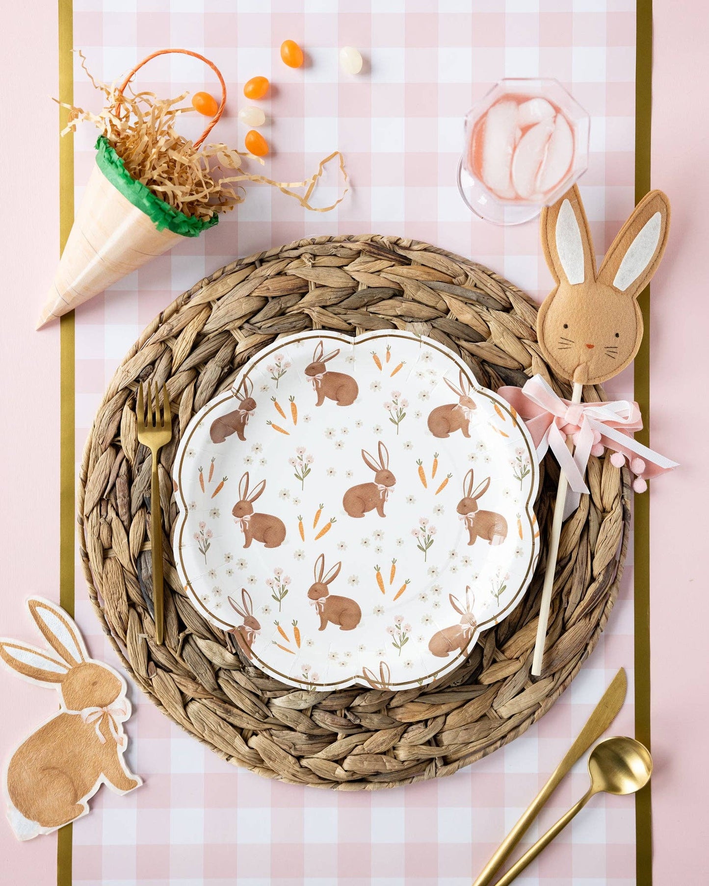 Rabbit scatter Easter plates styled on a spring table with woven placemats, pastel décor, and bunny accents