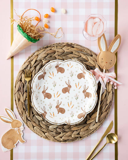 Rabbit scatter Easter plates styled on a spring table with woven placemats, pastel décor, and bunny accents