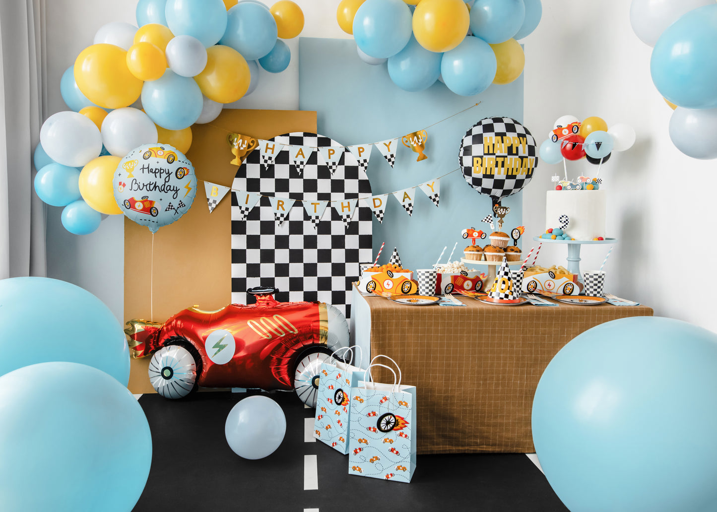 Race car themed birthday party setup with matching foil balloon available in Toronto and shipping across Canada